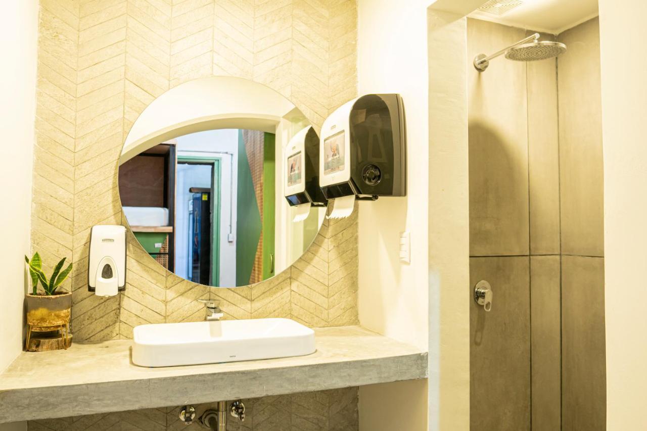 Adra Hostel Antigua Exterior photo A hand dryer in a bathroom