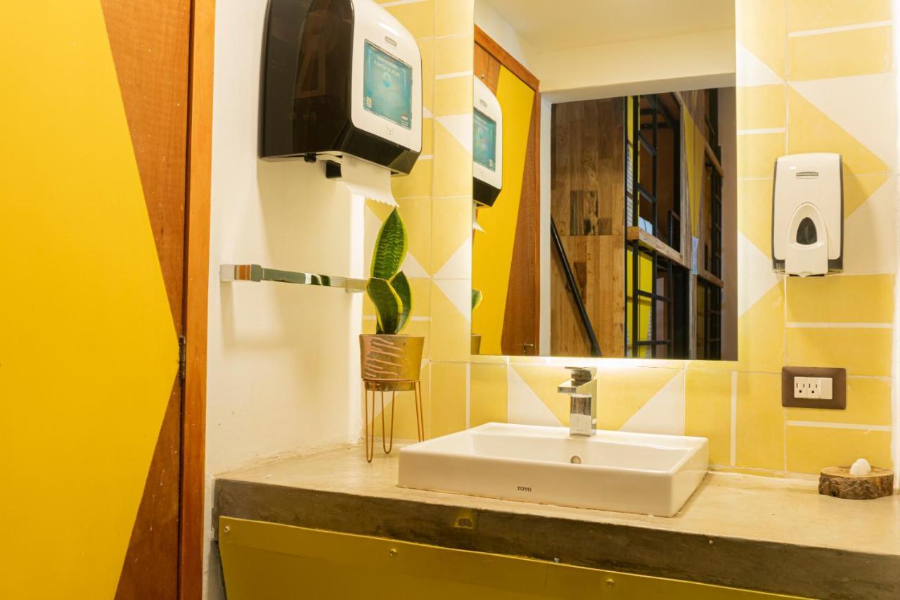 Adra Hostel Antigua Exterior photo A hand dryer in a bathroom