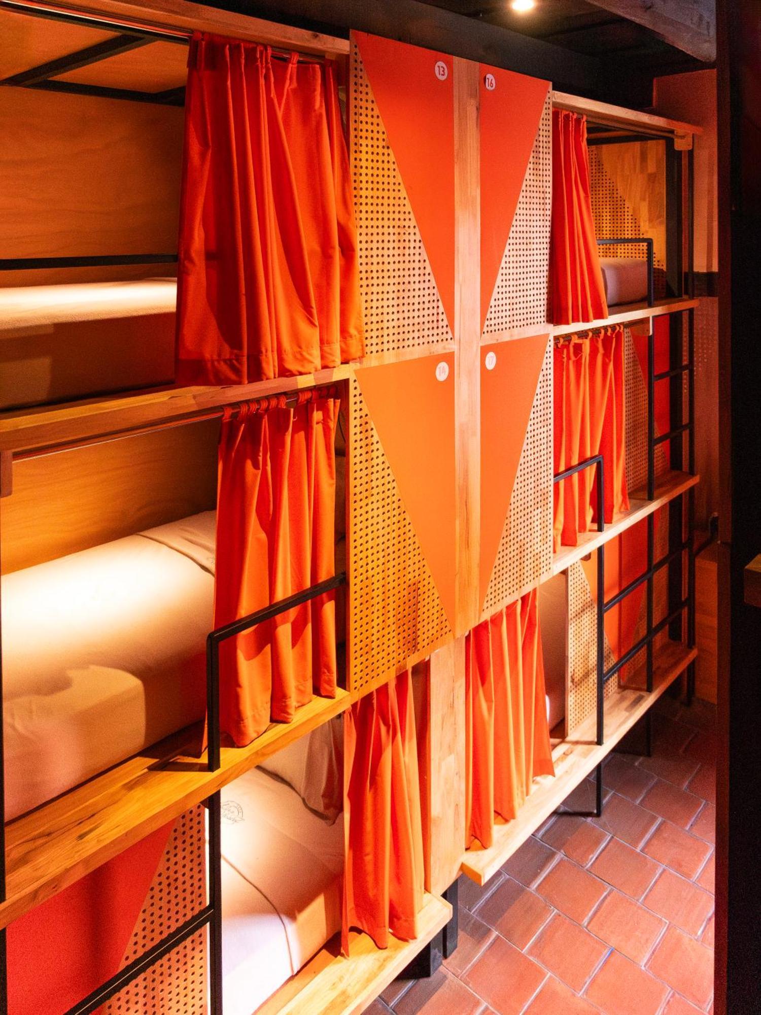 Adra Hostel Antigua Exterior photo Curtains in a capsule hotel